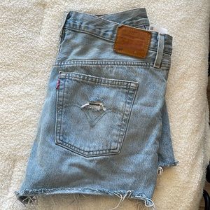 High waisted Levi jean shorts. Distressed/torn style.
